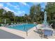 Inviting community pool with ample seating for relaxation and enjoyment at 200 Pinewinds Blvd, Oldsmar, FL 34677