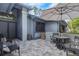 Spacious patio area featuring pavers, comfortable seating, and shade umbrella at 200 Pinewinds Blvd, Oldsmar, FL 34677