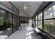 Bright sunroom with large windows offering abundant natural light and outdoor views at 200 Pinewinds Blvd, Oldsmar, FL 34677