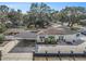 Aerial view of a white single-story home with a covered carport and manicured landscaping at 202 W Azalea Ave, Tampa, FL 33612
