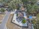 Aerial perspective showing the property, landscaping, and surrounding residential area from above at 202 W Azalea Ave, Tampa, FL 33612