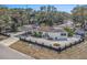 Aerial view showcasing a well-maintained home with a spacious yard, carport and tidy landscaping at 202 W Azalea Ave, Tampa, FL 33612