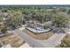 Aerial view of a charming home surrounded by mature trees in a peaceful neighborhood setting at 202 W Azalea Ave, Tampa, FL 33612