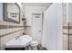 Bright bathroom featuring a vanity, toilet, shower, and mirror at 202 W Azalea Ave, Tampa, FL 33612