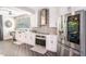 Bright kitchen features stainless steel appliances, modern cabinets, and a mosaic backsplash at 202 W Azalea Ave, Tampa, FL 33612