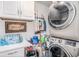 This laundry room features a washer, dryer, and storage at 202 W Azalea Ave, Tampa, FL 33612