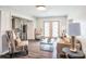 Bright and inviting living room with modern furnishings and an open view to the kitchen at 202 W Azalea Ave, Tampa, FL 33612