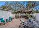 Cozy brick patio featuring comfortable seating, a covered pergola, and a peaceful outdoor ambiance at 202 W Azalea Ave, Tampa, FL 33612
