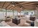 Covered patio with ample seating, perfect for entertaining guests in a relaxing outdoor setting at 202 W Azalea Ave, Tampa, FL 33612