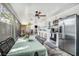 Spacious sunroom with an outdoor kitchen, dining area, and plenty of natural light at 202 W Azalea Ave, Tampa, FL 33612