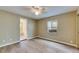 Bedroom showcasing wood floors, a ceiling fan, and a bright window at 2402 Harper St, Tampa, FL 33605