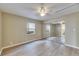 Bedroom featuring wood floors, mirrored closet doors, and a bright window at 2402 Harper St, Tampa, FL 33605