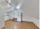 Bonus room with wood-look floors, a kitchenette, and natural light from the window at 2402 Harper St, Tampa, FL 33605