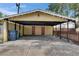 Carport area offers covered parking, complemented by secure storage and natural lighting at 2402 Harper St, Tampa, FL 33605