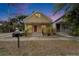 Inviting two-story home with covered front porch and a well-maintained lawn at 2402 Harper St, Tampa, FL 33605