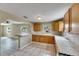 Bright kitchen showcasing a breakfast bar, efficient layout, and seamless integration with the adjacent living area at 2402 Harper St, Tampa, FL 33605