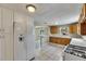 Spacious kitchen features a breakfast bar, stainless steel refrigerator, and gas stove at 2402 Harper St, Tampa, FL 33605