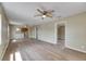 Open-concept living room with modern floors and a view of the adjacent kitchen, perfect for entertaining at 2402 Harper St, Tampa, FL 33605