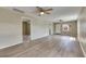 Bright and airy living room showcasing updated floors and a versatile layout for easy living at 2402 Harper St, Tampa, FL 33605