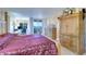 Bedroom with a private balcony, large windows with an ocean view, and a large wardrobe at 2504 Gulf Blvd # 201, Indian Rocks Beach, FL 33785