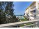 Balcony view showcasing the ocean, pool, and building, offering serene outdoor living and a coastal lifestyle at 2504 Gulf Blvd # 201, Indian Rocks Beach, FL 33785