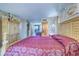 The main bedroom features an oversized layout with a large mirror adding depth to the space at 2504 Gulf Blvd # 201, Indian Rocks Beach, FL 33785