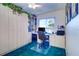 Home office features built-in shelving, cabinets, desk, and plenty of space for storage and organization at 2504 Gulf Blvd # 201, Indian Rocks Beach, FL 33785