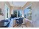 An office space with a view of the ocean, a corner desk, and lots of natural light at 2504 Gulf Blvd # 201, Indian Rocks Beach, FL 33785