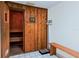 Relaxing sauna room with wooden benches, scale, and temperature controls at 2504 Gulf Blvd # 201, Indian Rocks Beach, FL 33785