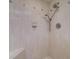 A tiled shower features two shower heads and a corner bench at 2504 Gulf Blvd # 201, Indian Rocks Beach, FL 33785