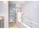 Modern bathroom with a tub, shower, and updated fixtures at 2524 Laurelwood Ln, Valrico, FL 33596
