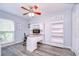 Bedroom featuring a desk, bookshelf, ceiling fan and a window offering natural light at 2524 Laurelwood Ln, Valrico, FL 33596