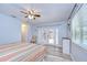 Bright bedroom with doors to the backyard and neutral decor at 2524 Laurelwood Ln, Valrico, FL 33596