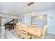 Spacious dining area showcasing wood floors, piano and neutral wall paint at 2524 Laurelwood Ln, Valrico, FL 33596
