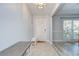 Welcoming foyer with tile flooring and natural light with views to the formal dining room at 2524 Laurelwood Ln, Valrico, FL 33596