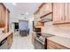 Eat-in kitchen featuring stainless appliances, tile backsplash, and breakfast nook at 2524 Laurelwood Ln, Valrico, FL 33596