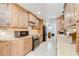 Well-equipped kitchen with stainless steel appliances and light wood cabinetry at 2524 Laurelwood Ln, Valrico, FL 33596