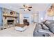 Spacious living room featuring a stone fireplace and tile flooring at 2524 Laurelwood Ln, Valrico, FL 33596
