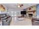 Bright living room featuring a stone fireplace and access to the backyard at 2524 Laurelwood Ln, Valrico, FL 33596