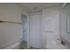 Bathroom with a closet and a single sink vanity at 2608 Browning St, Sarasota, FL 34237