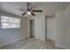 Bright bedroom with closet, window and wood-look flooring at 2608 Browning St, Sarasota, FL 34237