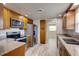 Modern kitchen featuring stainless steel appliances, granite countertops, and wood-look flooring at 2608 Browning St, Sarasota, FL 34237