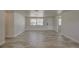 Neutral living room featuring modern wood-look floors, fresh paint, and bright natural light at 2608 Browning St, Sarasota, FL 34237