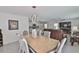Combined dining and living area featuring an open concept and modern lighting at 2858 Star Anise Ln, Wimauma, FL 33598