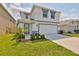 Charming two-story home with a well-manicured lawn and inviting entrance at 2858 Star Anise Ln, Wimauma, FL 33598