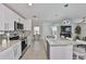 Modern kitchen featuring white cabinets, stainless steel appliances, and granite countertops at 2858 Star Anise Ln, Wimauma, FL 33598