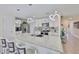 Stylish kitchen with a large island, modern lighting, and stainless steel appliances at 2858 Star Anise Ln, Wimauma, FL 33598