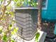 Air conditioning unit surrounded by foliage, ensuring a cool and comfortable home at 3031 56Th S St, Gulfport, FL 33707