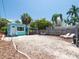 Landscaped backyard has gravel, and patio area with seating, perfect for entertaining at 3031 56Th S St, Gulfport, FL 33707