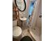 Charming bathroom featuring a pedestal sink, toilet, and shower with a decorative floral curtain at 3031 56Th S St, Gulfport, FL 33707